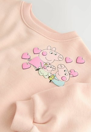 Lichtroze sweatshirt met een speels ontwerp van drie cartoonvarkens en harten. Zachte stof met ribbelkraag en manchetten.