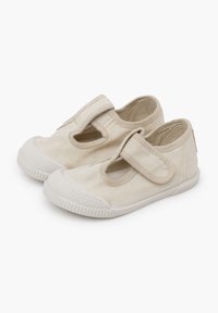 Plátěné Mary Jane boty v off-white barvě, s suchým zipem, kulatou špičkou, texturovanou gumovou podrážkou a bočním šitím.