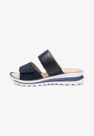 Navy blue slide sandal with two adjustable straps, cushioned beige footbed, and white sole with blue accent and textured tread.