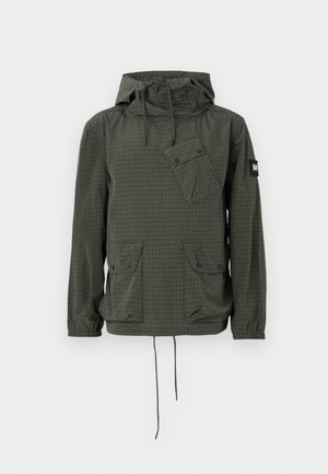 Green checkered jacket with a drawstring hood, multiple pockets, and elastic cuffs. Made of lightweight fabric, featuring a slightly textured finish.