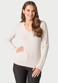 Maglione lavorato a maglia di colore crema con scollo a v e maniche lunghe. Presenta un motivo a treccia e polsini e orlo a coste.