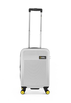 Gray hard-shell suitcase with vertical grooves, extendable handle, four yellow rotating wheels, and a National Geographic logo on the front.