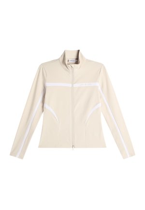 Béžová bunda na zip s vysokým límcem, dlouhými rukávy a bílými vodorovnými a diagonálními pruhy na přední straně a rukávech.