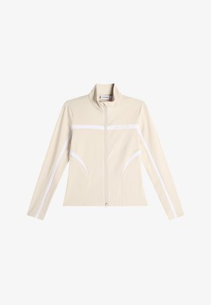 Béžová bunda na zip s vysokým límcem, dlouhými rukávy a bílými vodorovnými a diagonálními pruhy na přední straně a rukávech.