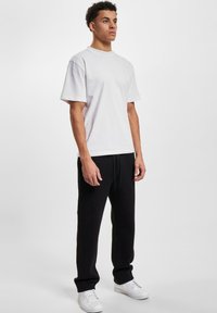 DEF Trainingsbroek - black