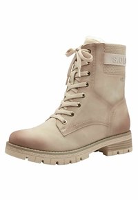 Bottines à lacets beige avec panneau texturé et doublure en fausse fourrure. Semelle en caoutchouc avec grips et œillets métalliques pour les lacets. Effet ombré subtil.