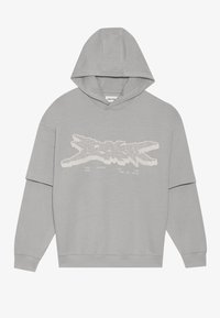 Felpa grigia chiara realizzata in morbido cotone. Presenta una grafica frontale con testo bianco che ricorda una silhouette. Maniche lunghe e un grande cappuccio.