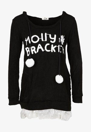 Maglione nero a maniche lunghe con scritta bianca "Molly Bracken", due pon pon sui lacci e bordo in tulle bianco a pois sull'orlo.