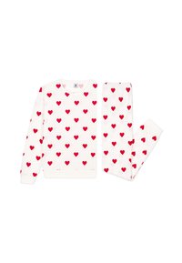 Witte top en broek set gemaakt van zachte stof, met een herhaald patroon van kleine rode hartjes, voorzien van geribde cuffs en tailleband.