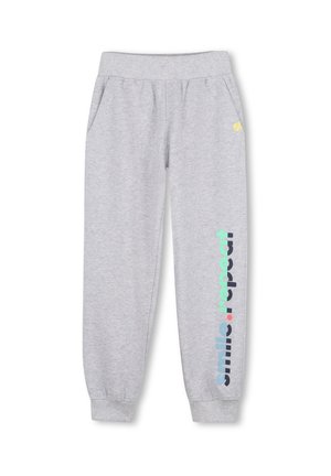 Pantalon de survêtement gris clair avec taille et poignets élastiques, poches latérales, et la phrase "smile . repeat" imprimée verticalement sur une jambe.