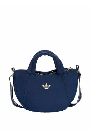 Marineblauwe stoffen handtas met twee korte hengsels, verstelbare schouderband, gouden rits en een wit Adidas trefoil-logo aan de voorkant.