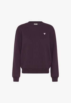 Tumevioletne pikkade varrukatega pahempidi kampsun, millel on soonilised kätised ja alumine ääreosa ning peal vasakul rinnal väike helesinine süda.