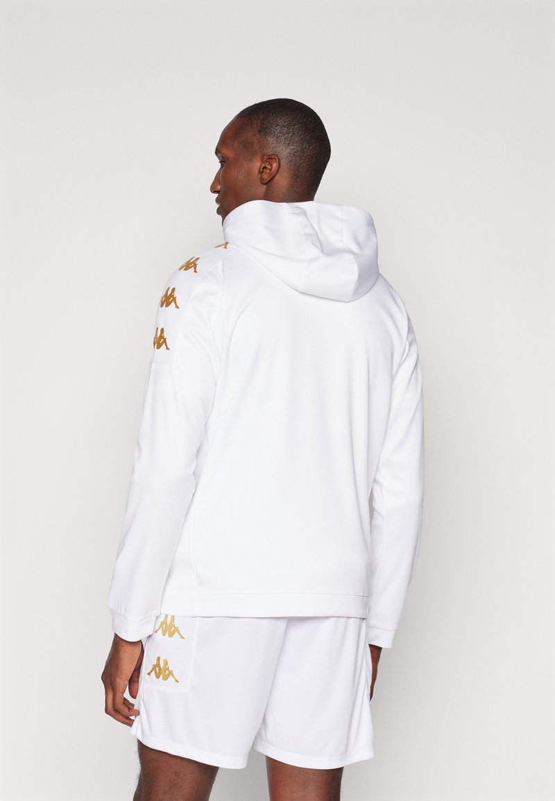 Survêtement femme en PVC blanc brillant | Ensemble veste et pantalon en