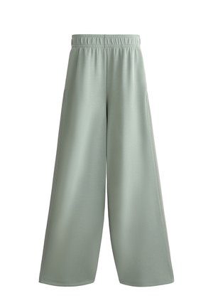 Hellegrüne weit geschnittene Hose aus weichem Stoff, mit einem dehnbaren Bund und zwei seitlichen Taschen, die eine glatte Textur und keine sichtbaren Muster aufweist.
