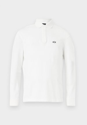 Witte langslavige polo shirt van katoen, met een knoopsluiting op de kraag en een klein zwart logo op de linker borst. Eenvoudig ontwerp zonder patronen.