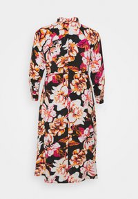 Robe fleurie à manches longues avec fond noir, présentant de grandes fleurs blanches, orange et roses, vue de dos.