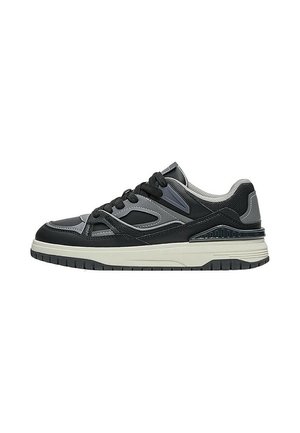 Black and gray low-top sneaker with white sole, black laces, mesh heel, and layered synthetic upper panels.