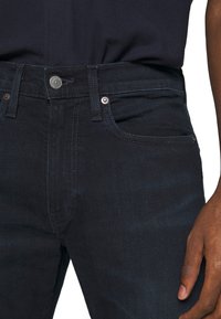 Levi's® 502 TAPER - Calças de ganga de corte afunilado - blue ridge
