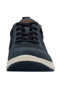 Navy blue sneaker featuring a smooth leather toe cap, mesh paneling, laces, and a side zipper. Cream-colored sole with textured surface.