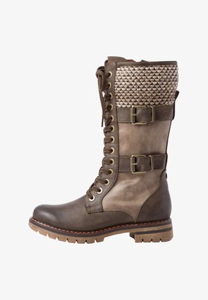 Brown leather lace-up boot with braided textile upper, two buckles, and rugged sole. Features a rounded toe and contrasting stitching.