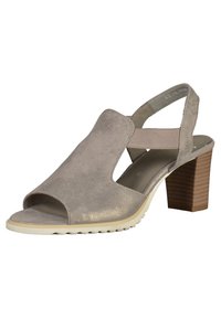 Sandaali, jossa on taupe-nahka päällinen, avokärkinen ja takana oleva hihna. Siinä on beigen värinen kumipohja ja 3 tuuman paksu puinen korko.
