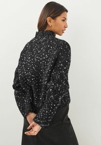 Next Trui - black
