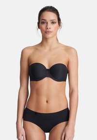 Black strapless bra with soft cups, smooth texture, and underwire support. Paired with black seamless bikini-style bottoms.