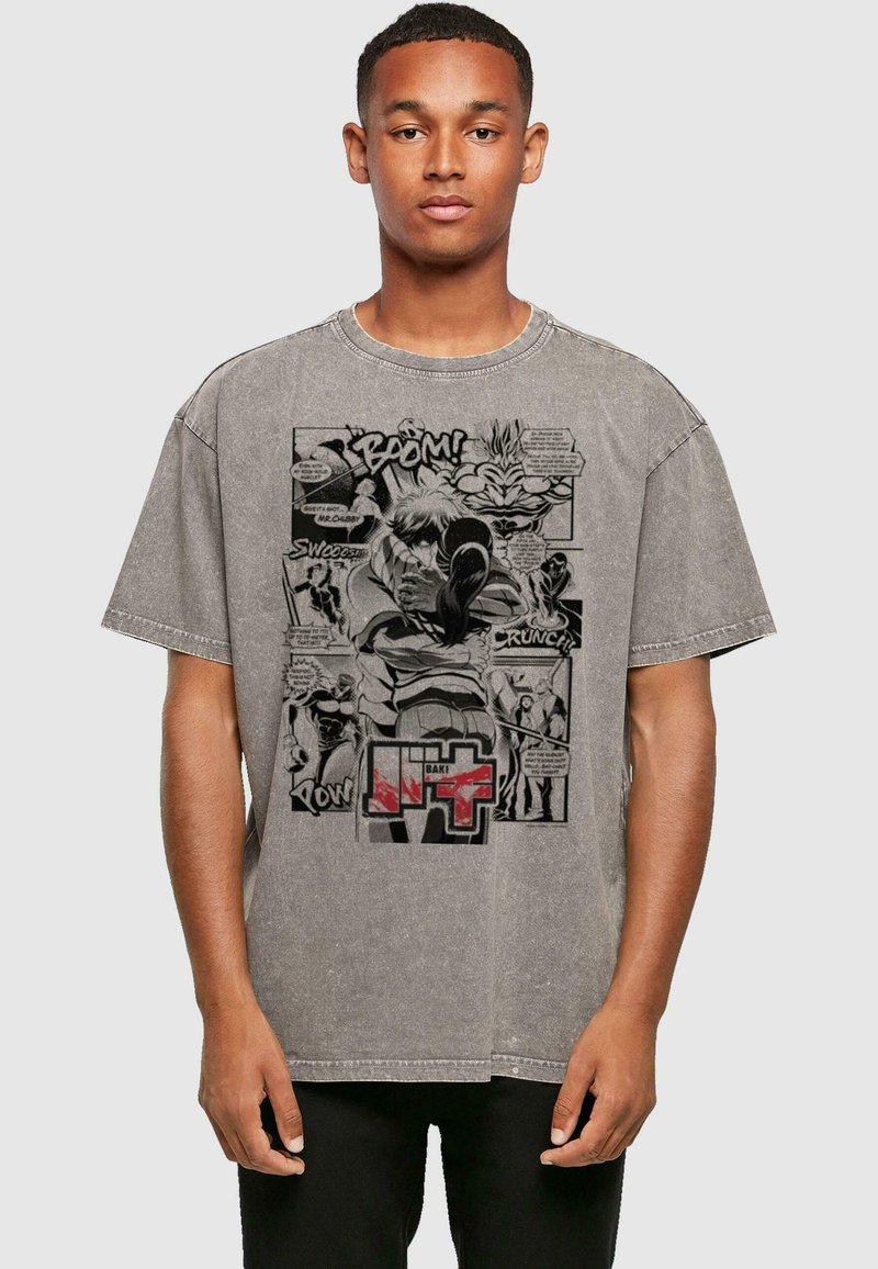 Gray oversized T-shirt featuring a comic-style graphic print with text and characters in black and red, showcasing a bold design and casual fit.