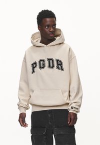 Pegador CARLO HOODIE - Jersey con capucha - washed desert sand