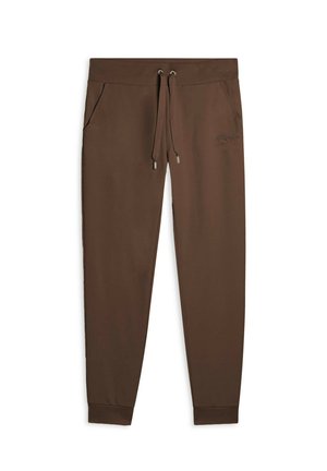 Pantaloni della tuta marroni realizzati in tessuto morbido, con vita regolabile tramite cordoncino, due tasche laterali e polsini a costine. Presenta un logo discreto sulla coscia sinistra.