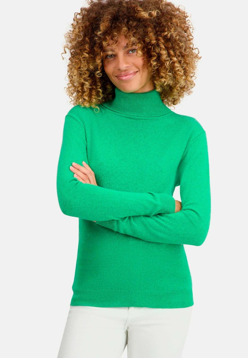 Grüner Rollkragenpullover mit figurbetontem Design und langen Ärmeln. Weicher Stoff, mit gerippten Akzenten am Kragen und Saum.