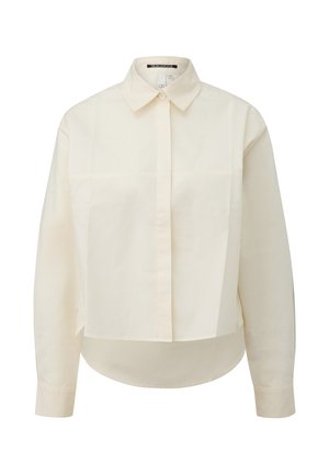 Chemise boutonnée à manches longues, couleur crème, avec col, patte de boutonnage frontale et ourlet légèrement incurvé. Fabriquée en tissu lisse.