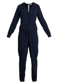 Combinaison longue bleu marine à manches longues avec un col en V, un devant boutonné, une ceinture ajustable à la taille et des jambes fuselées. Fabriquée dans un tissu lisse et léger.
