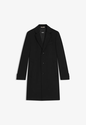 Schwarzer maßgeschneiderter Mantel mit Reverskragen, drei vorderen Knöpfen und Seitentaschen. Verfügt über knöpfbare Ärmel und eine glatte Textur.
