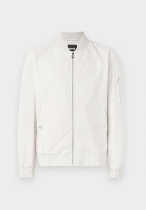 White bomber jacket made of smooth fabric, featuring a front zipper, ribbed collar, and elastic cuffs with side pockets and arm pocket.