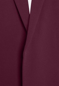 Burgundy blazer with a smooth texture, featuring a notched lapel and a tailored fit. The fabric appears lightweight and softly draped.