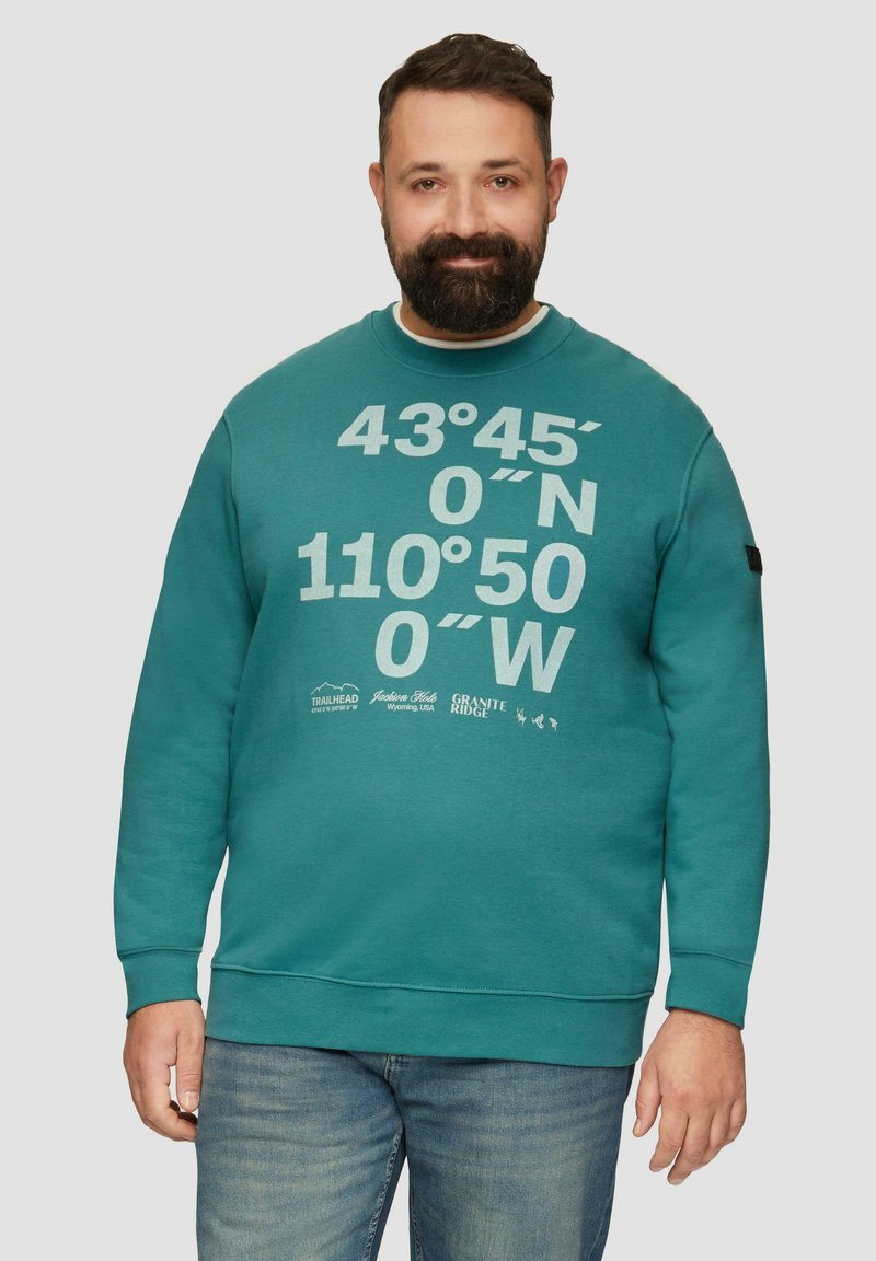 Sweatshirt en teal à col ras du cou avec impression graphique blanche des coordonnées et logos. Manches longues avec poignets et ourlet inférieur côtelés. Matière en mélange de coton.