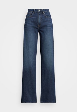 Jean femme taille haute bleu foncé à coupe large, avec bouton et fermeture éclair devant, poches avant et arrière, présenté sur fond blanc.