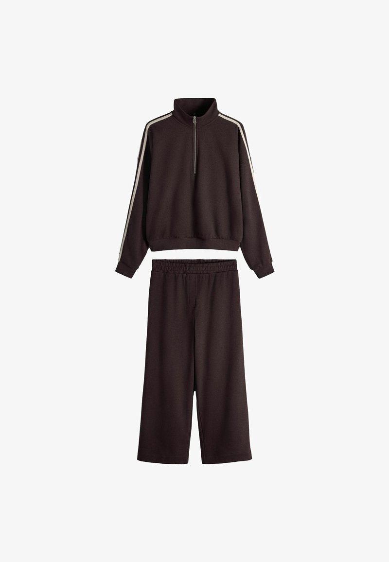 Dark brown two-piece outfit with long-sleeve zippered top featuring white shoulder stripes and matching wide-leg pants with elastic waist.