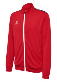 Rød zip-up jakke lavet af letvægtsstof, med ribbet krave, hvid lynlås, sidelommer og sorte detaljer på skuldrene.