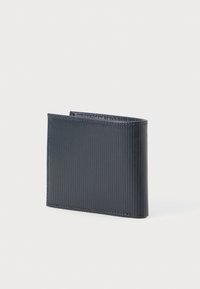 Navy blue card holder made of textured material with horizontal ridges. Slim, rectangular shape; finished edges and minimal design.