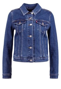 Modrá džínová bunda s límečkem, knoflíkovým zapínáním a kapsami na prsou. Ošuntělý vzhled s viditelným švem a akcenty.