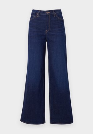 Jeans a gamba larga blu scuro realizzati in denim, caratterizzati da un'alta vita, design a cinque tasche e cuciture arancioni a contrasto lungo le cuciture.