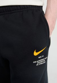 Nike Sportswear JOGGER   - Treniņtērpa apakšdaļas - black
