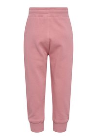 Mjukisbyxor med elastisk midja och cuffs, tillverkade av mjukt rosa tyg, med en slät textur och smal passform.