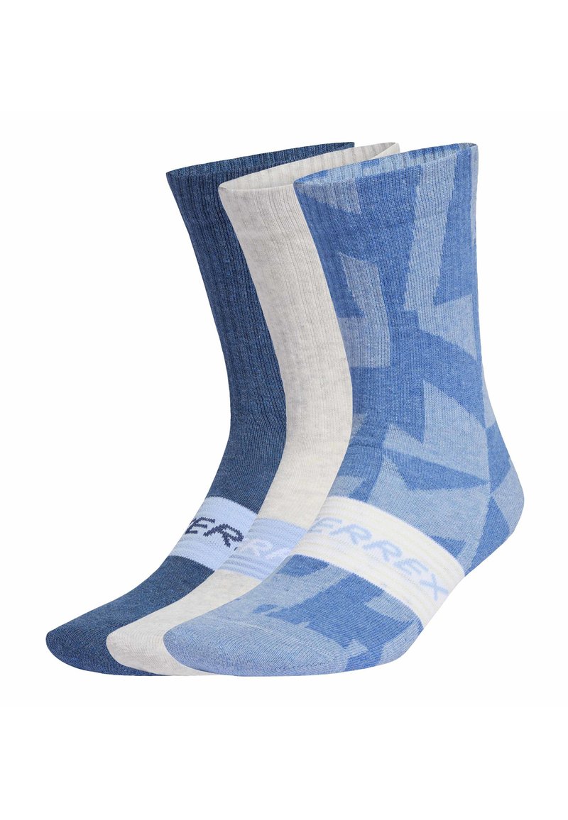 Tre paia di calze a metà polpaccio in tonalità di blu: blu scuro uniforme, grigio chiaro uniforme e blu chiaro con un motivo geometrico più scuro e una banda bianca.