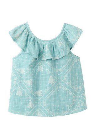 Haut sans manches bleu clair pour tout-petit avec motif floral blanc en forme de losange et encolure bardot à volants.