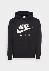 Sudadera negra de tela suave, con un gran logo blanco de Nike y el texto "AIR" en la parte frontal, con capucha ajustable y puños acanalados.