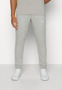 adidas Sportswear ESSENTIALS TAPERED CUFF 3-STRIPES  - Treniņtērpa apakšdaļas - medium grey heather