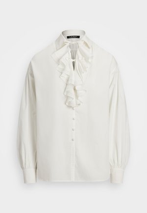 White, long-sleeve blouse with a ruffled collar, button front, and gathered cuffs. Made from smooth fabric with a soft texture.